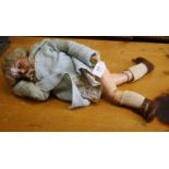 An Armand Marseille porcelain headed doll with open mouth and sleeping eyes, fitted to a jointed
