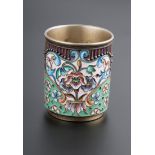 A.E., a cylindrical silver gilt and enamel Russian vodka cup, St Petersburg, 84 mark, 5cm