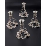 A matched set of four Irish silver rococo form table candlesticks, Dublin 1968/1969, 17.5cm