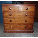A Victorian mahogany chest of two short and three graduated long drawers, with knop handles on a