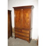 An Edwardian mahogany linen press, in the Chippendale style, with blind fret detail, 112cm wide