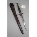 A Fairbairn - Sykes 2nd pattern fighting knife and scabbard with knurled grip, the hilt marked