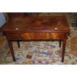 A George III mahogany supper table, the rectangular fold-over top with moulded edge over end