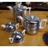 An Art Deco ' Everhot' stainless steel clad four piece tea set with moulded outline