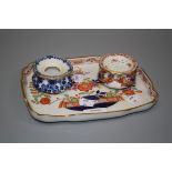 A late Meissen dressing table tray, decorated in the Japanese manner, supporting a hat pin stand and