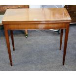 A George III style inlaid mahogany fold over card table with square supports, 83.5cm wide