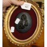 A moulded simulated bronze oval relief of Lord Nelson in a gilt frame, 10.5 x 8.5cm