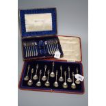 L and Co., a cased set of twelve silver teaspoons and sugar tongs, each with bright cut decoration