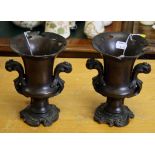 A pair of 19th century patinated bronze two handled urns with pierced spreading rims, 19.5cm high