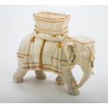 A Royal Worcester flower vase, modelled as a bull elephant with howdah, 19 x 23cm, impressed and