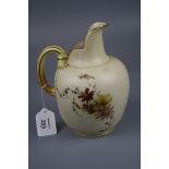 A Royal Worcester flat back jug, Design No 1094, florally decorated on an ivory and gilt ground,