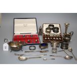 A silver sauce boat, Birmingham 1936, a silver cream jug, Birmingham 1920, a cased set of rat tail