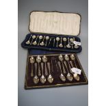 William Hutton and Sons Ltd, a cased set of twelve silver teaspoons and sugar tongs, each with