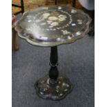 A Jennens and Bettridge style Victorian papier maché table with cartouche shaped top painted with