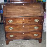 A George III mahogany bureau, the crossbanded fall with ivory escutcheon enclosing a fitted interior