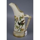 A Royal Worcester ice jug, design number 1116, with tusk handle, decorated in coloured enamel with