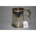 Wilson and Gill, a silver cylindrical tankard with beaded swept handle, and Edward VIII