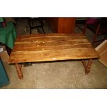 An early 20th century Italian Tyrol type olive low table with rectangular top on ring turned