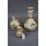 A Royal Worcester jug, with lobed body and twig handle, Design No 1507, together with a tall Royal