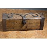 An 18th century iron bound oak coffer, with scrolled splayed strapwork and garter crest escutcheon