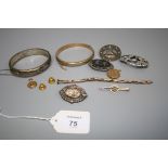 A 9ct gold foliate engraved bangle, a late Victorian gold back and front locket, a small quantity of