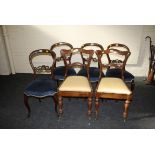 A matched set of four Victorian walnut spoon back dining chairs, each having moulded rail, pierced