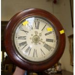 A 19th century Postman's alarm clock, the mahogany frame enclosing a thirty-hour bell striking