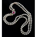 A two row cultured pearl necklace to a ruby and diamond cluster clasp, the mainly uniform pearls