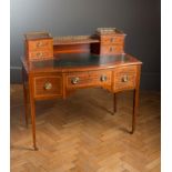 An Edwardian mahogany, satin crossbanded and ebony strung lady's writing desk, the brass galleried