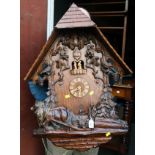 A large contemporary Black Forest cuckoo clock, the architectural case decorated with squirrels,