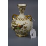 A Royal Worcester twin handled vase of baluster form, design number 1109, decorated in coloured