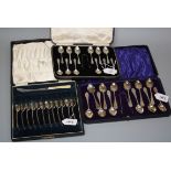 B.B.S. Ltd, a cased set of twelve silver teaspoons and sugar gongs, each with bell flower cast