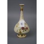 A late 19th century Royal Worcester single stem vase, with elongated tapering neck and florally