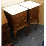 A pair of French oak pot cupboards, each having a square marble top over a frieze drawer and