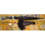 A 19th century gentleman's umbrella, with black canopy, ebonised shaft and Indian silver knop