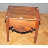 A George III field walnut commode stool, with hinged lid, ceramic liner with wood cover, shaped