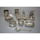 A cylindrical silver christening mug with banded decoration and shaped handle, London 1881, together