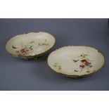A pair or Royal Worcester oval comport dishes, design number 1427, decorated with flowers, insects