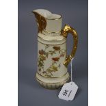 A Royal Worcester mask spout jug, design number 1366 with stepped cylindrical body and textured