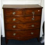 A Regency mahogany bow front chest, the rosewood crossbanded top over two short and three