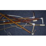 A bundle of six Victorian and Edwardian horn and bone handled riding crops including two with