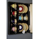 A mid 20th century cased Aynsley set of six coffee cans and saucers, variously glazed beneath