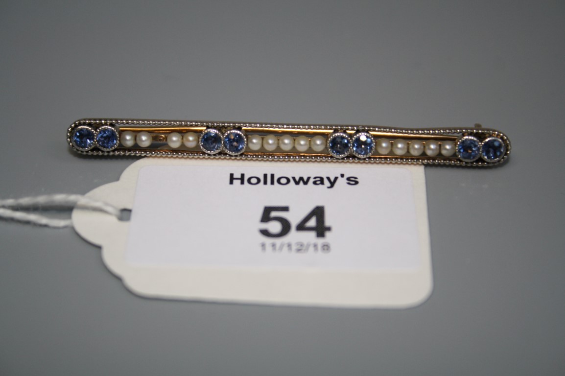 An early 20th century sapphire and seed pearl bar brooch, the circular cut sapphires and seed pearls