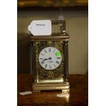 J. W. Benson (retailers), a 20th century brass five glass carriage timepiece, the four column case