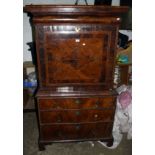 An 18th century walnut escritoire, the moulded cornice over a cushion frieze drawer and