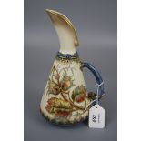 A Royal Worcester arabesque form ewer, Design No 1361, florally decorated with autumnal leaves on
