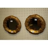 A pair of probably Swedish carved pine gilt wreath mirrors, with later mirror plates, 24cm diameter