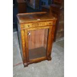 A 19th century walnut, boxwood strung pier cabinet, the rectangular top over a frieze drawer with
