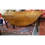 A George III mahogany Irish wake table of oval form with squared supports, 178cm long