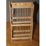 A 19th century pine wall mounting kitchen plate rack, with stick back and shaped sides, 75 x 39cm